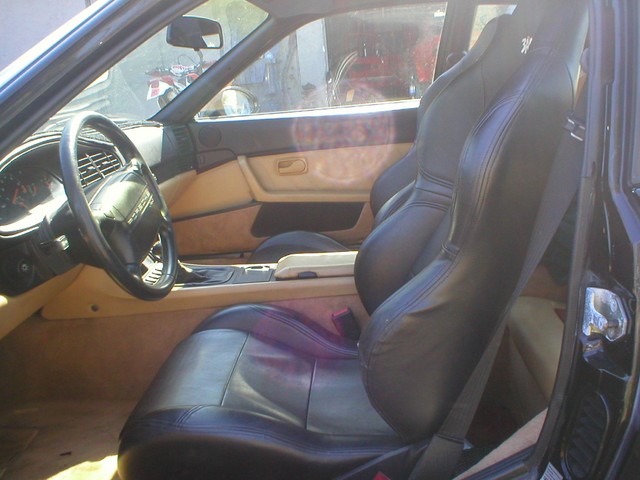 Leather reclining race seats.