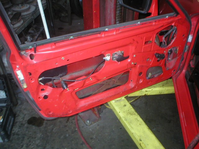 Drivers gutted door. Still a few things in there that are going to get torn out. Manual roll up windows are from a 924.