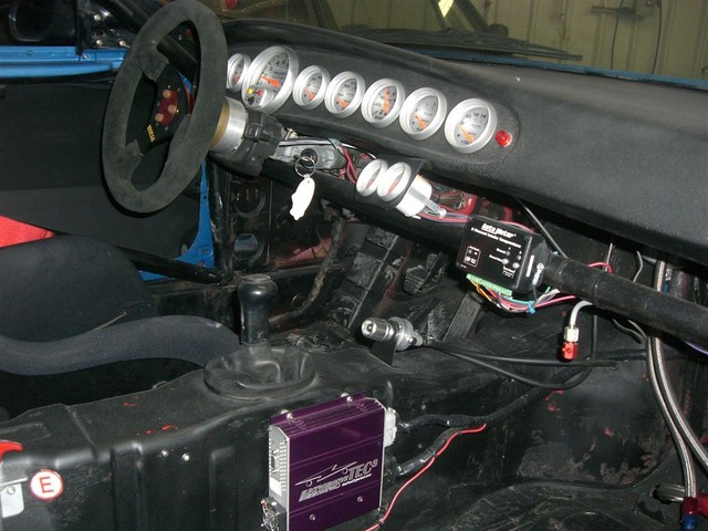 Holy gauges batman! Water temp, tach, oil temp, oil pressure, fuel pressure, boost/vacuum, fuel level, dual channel intake temperature, and voltage, plus an AFR gauge on the left of the steering column.