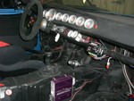 Holy gauges batman! Water temp, tach, oil temp, oil pressure, fuel pressure, boost/vacuum, fuel level, dual channel intake temperature, and voltage, plus an AFR gauge on the left of the steering column.