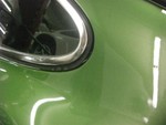 Quarter windows have visible gaps at the rear edges.