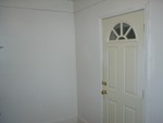 Backdoor out of laundry room and pantry room. Leads out to the backyard.