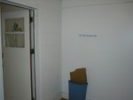 In pantry room looking at door that leads to the kitchen.