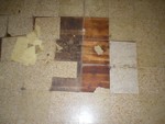 Floor in the 3rd bedroom. We have to use a heat gun to pull all the linoleum off the floor then work on refinishing the wood floor underneath it.
