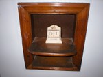 Neat little built in shelf between kitchen and hallway. 