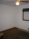 Master bedroom looking from wall facing side of house to corner facing livingroom/front of the house.