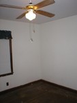 Master bedroom looking towards corner that is facing the side of the house and the bathroom.
