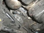 This is from in front of the subframe looking sorta rearward (mostly upward). The starter would be in the hole just above where the socket is sitting. That entire mount braket must be removed from the engine to get the starter out.