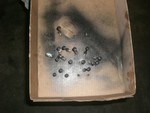 Hard to see in the photo, but the bolts are stuck through holes in the cardboard. The holes are mapped out to match the pattern in the valve body. This, coupled with the diagram taped to the bottom of the car, kept all of the bolts with the right hole. Out of the 22 bolts that hold the valve body on I think there were 6 different lengths.
