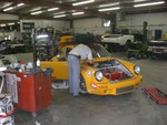 Here we are at 3:16pm, no wiper motor (nor wiring etc), no lights, still with the fiberglass doors that must be changed to the steel doors so he can have windows. The car has a fiberglass roof that was never intended to get windows, so we had to extensively modify the frames to get the doors to fit the roof. At this point the engine has still never run.