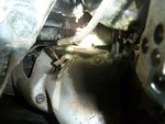 P1000287 - At the top of the photo is the hose that is leaking and you can see a bit where its been dripping on the transmission.