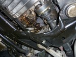 Oil leaking down the side of the engine. You can also see a leaking CV boot here (passenger side inner).