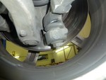 Drivers side lower forward control arm with a boot starting to tear.