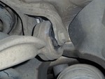 This is the drivers side upper rearward control arm inner bushing. On this one you can see significant wear where it was contacting it's mount. A significant amount of material has been worn off of the mount as well.