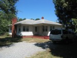 Front of the house. Chimney faces the road.
