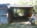 This is the back of the workshop, and another carport.