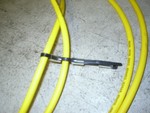 Then go over the next wire and through the next hose section.