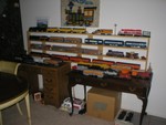 The black and orange one on the bottom row of the shelf, and the red/silver one on second from bottom are mine.